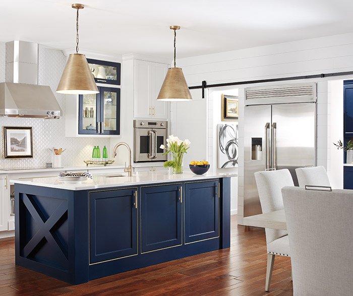 White kitchen with a custom blue kitchen island in the Renner door style