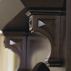 Close-up of decorative corbels in Cherry Kodiak finish