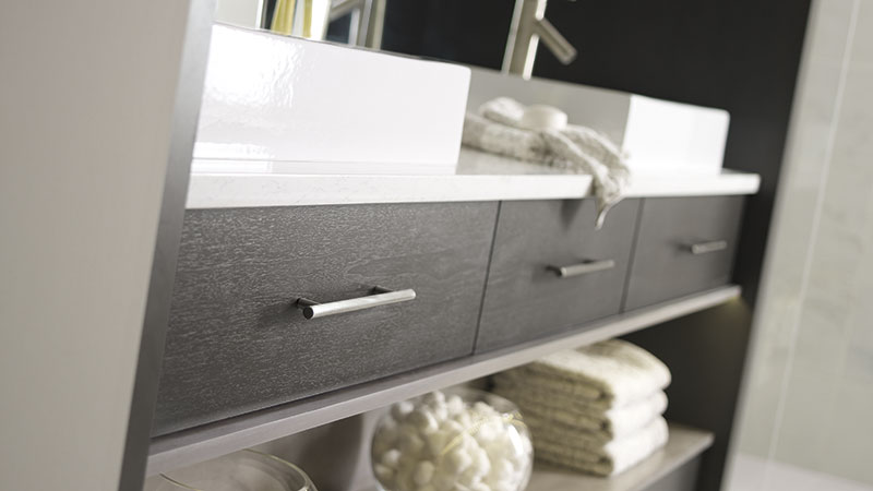 Close-up of Tarin bathroom vanity cabinets in Walnut Smokey Hills finish