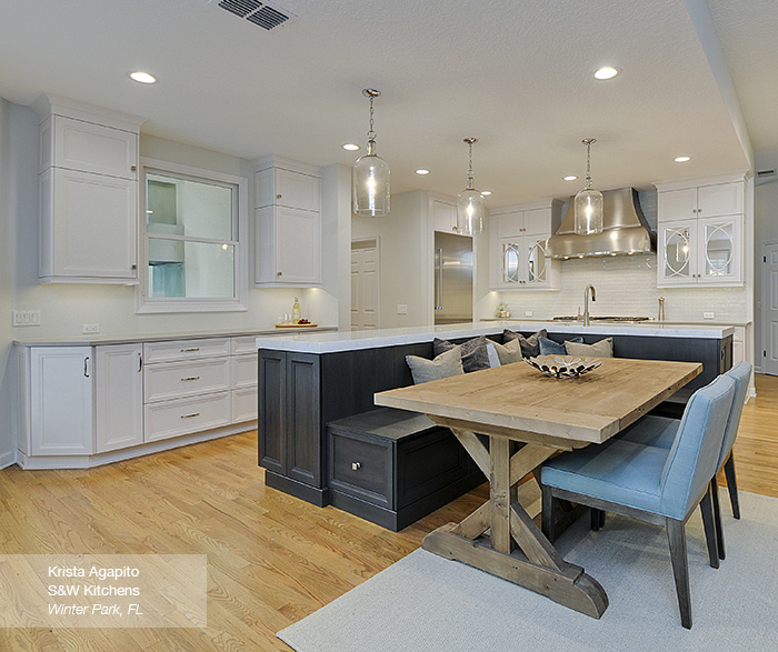 Kitchen Featuring An Island With Bench Seating Omega