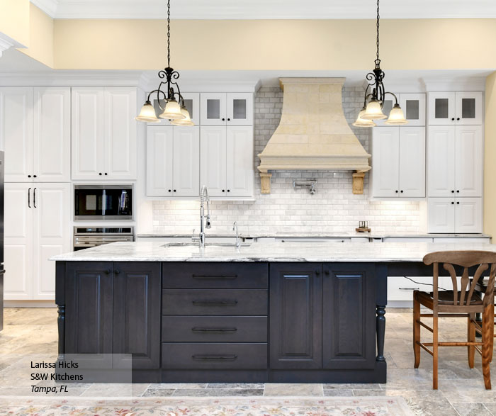 Traditional kitchen with white cabinets and a gray kitchen island