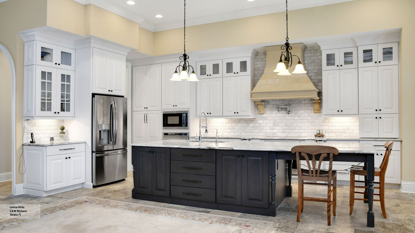 Kitchen With White Cabinets And A Gray Island Omega