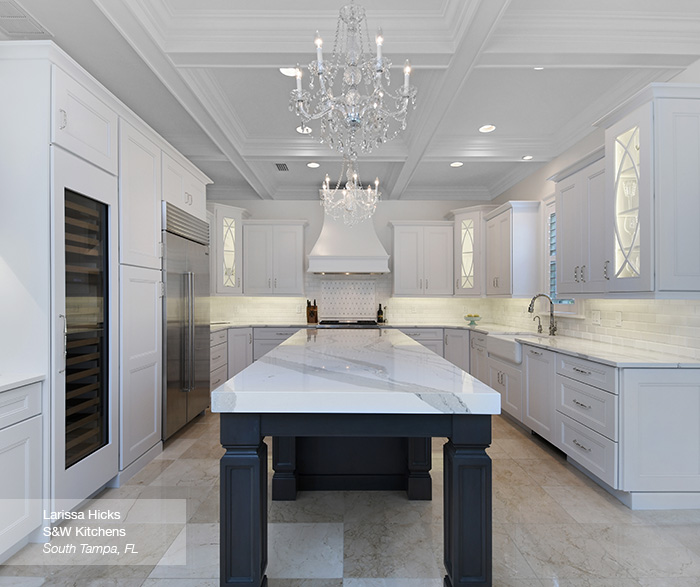 White Kitchen Cabinets With A Dark Grey Island Omega