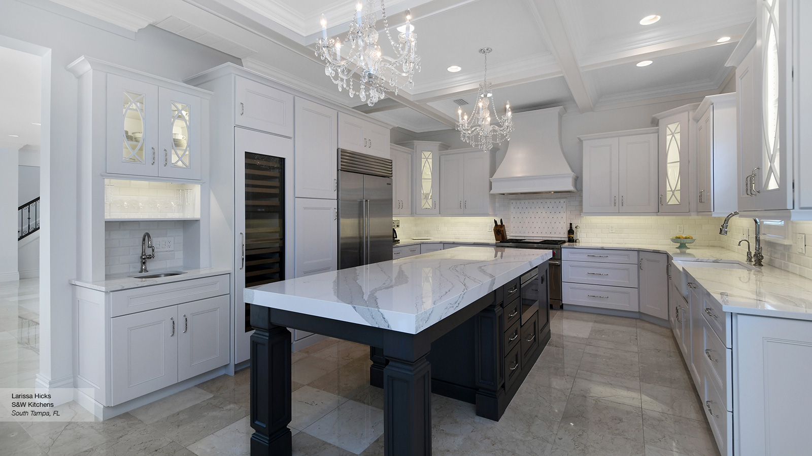 White Kitchen Cabinets With A Dark Grey Island Omega