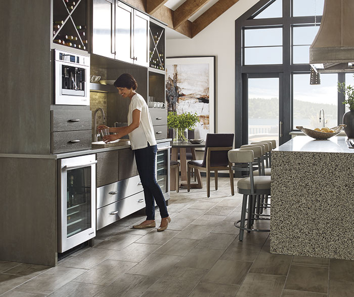 Woman using the sink in Lyssa and Tarin kitchen