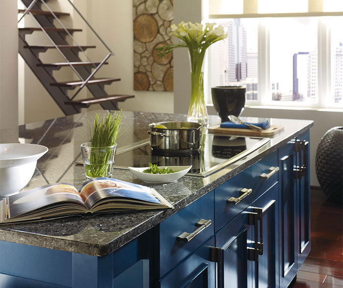 Dark Wood Cabinets with a Blue Kitchen Island