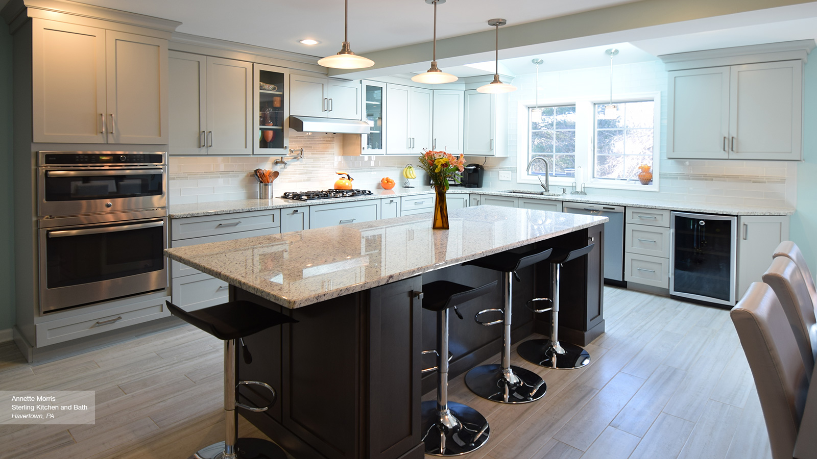 light grey kitchen cabibets with dark grey island