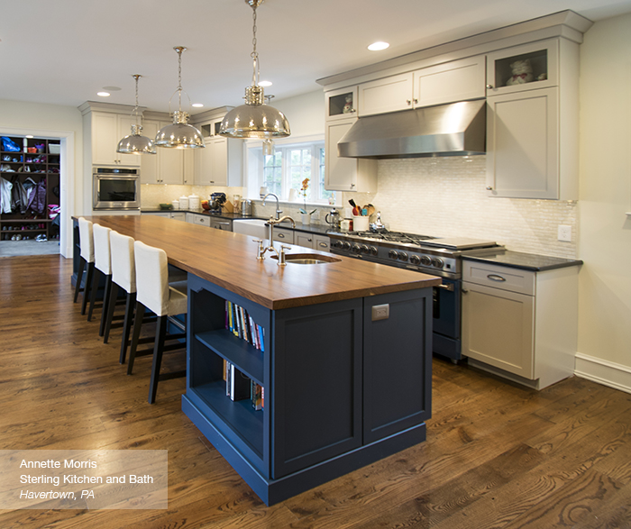 Puritan Off white cabinets in maple magnolia with a blue kitchen island blue lagoon