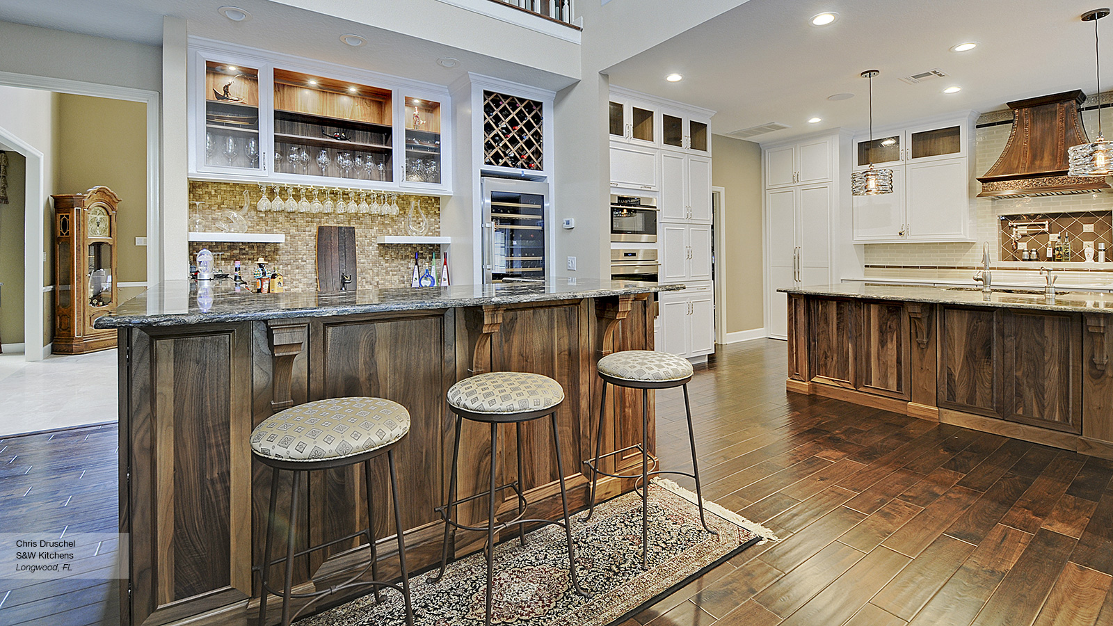 White Cabinets With A Walnut Kitchen Island Omega