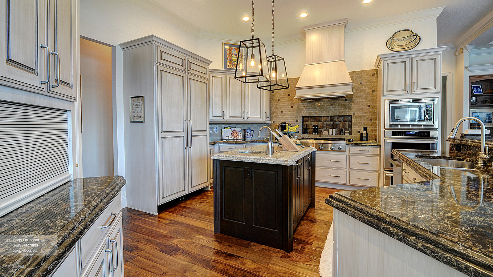 Off White Cabinets with a Dark Wood Kitchen Island - Omega