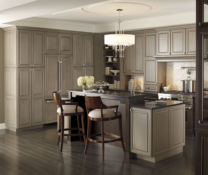 Traditional kitchen with Brookside and Riff Cherry cabinets in Pumice and Chestnut finishes