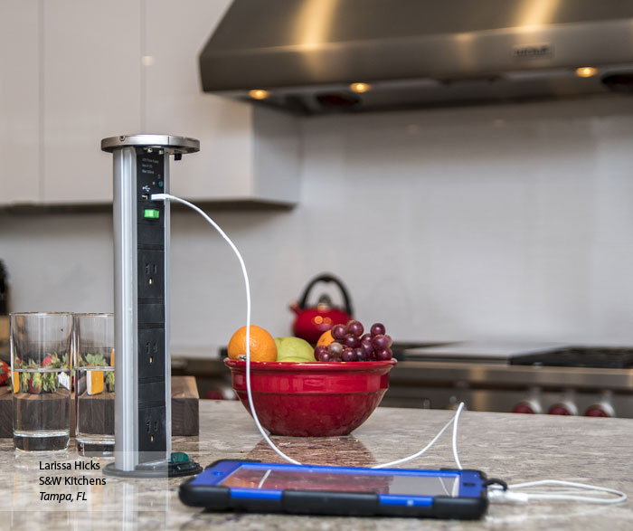 Cell phone being charged with a Sensio PowerPod in the kitchen island